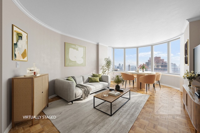 living area featuring a view of city, baseboards, and crown molding