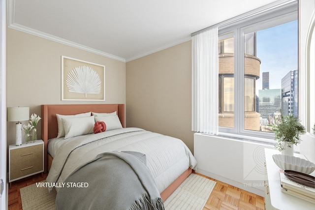 bedroom featuring ornamental molding and a view of city