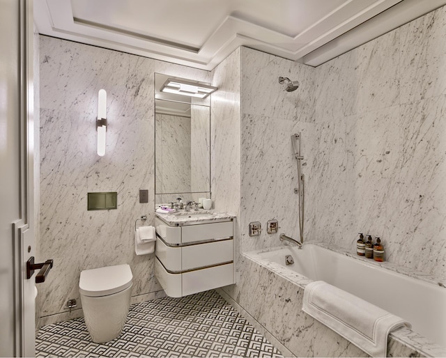 bathroom featuring toilet, tile patterned floors, vanity, and a combined bath / shower with marble appearance