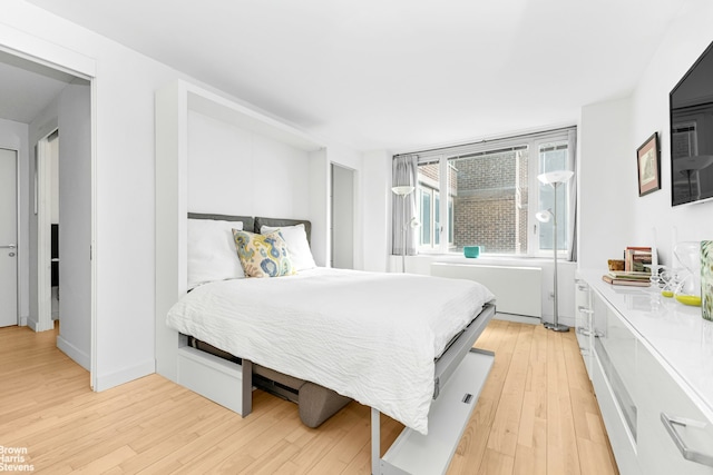 bedroom featuring light wood-style floors