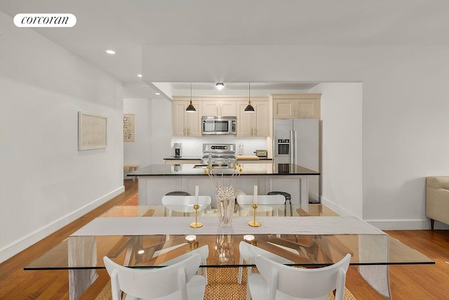 dining room with visible vents, recessed lighting, baseboards, and light wood-style floors