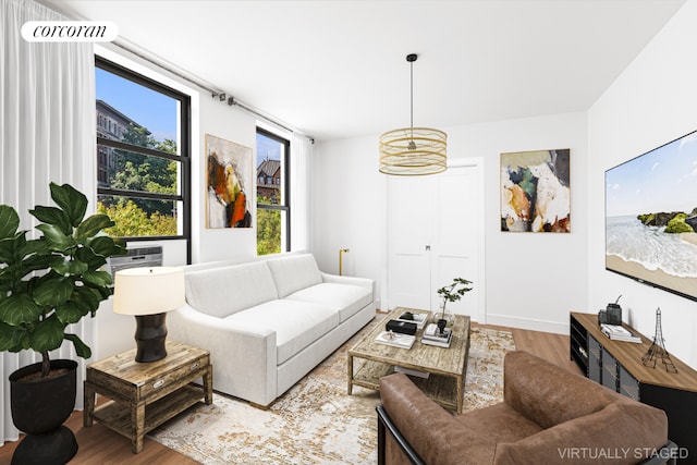 living room featuring light wood-type flooring and baseboards