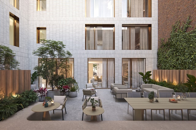 back of property with a patio, fence, and an outdoor hangout area