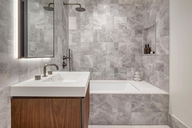 full bath featuring vanity and tile walls