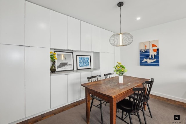 dining space with recessed lighting and baseboards