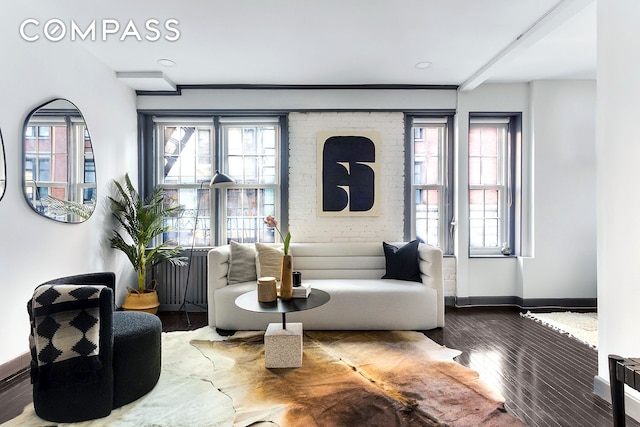 57 Thompson St Unit 2B, New York City, NY 10012 - living area featuring wood finished floors and healthy amount of natural light