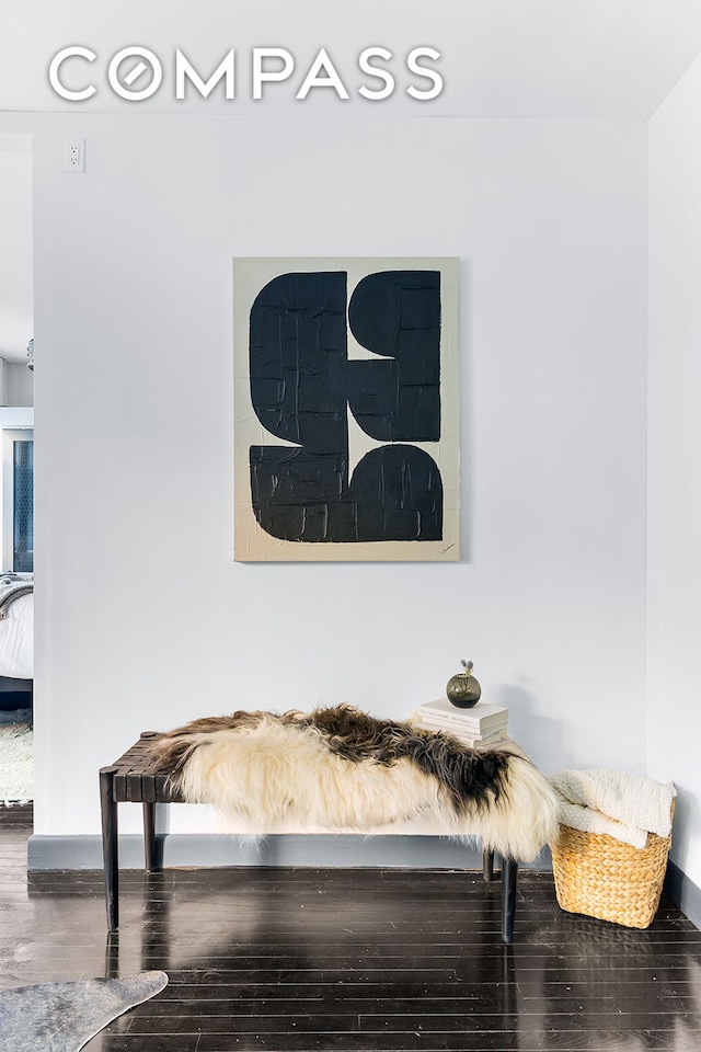 interior details with wood finished floors and baseboards