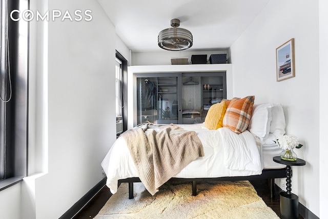 57 Thompson St Unit 2B, New York City, NY 10012 - bedroom with baseboards and wood finished floors