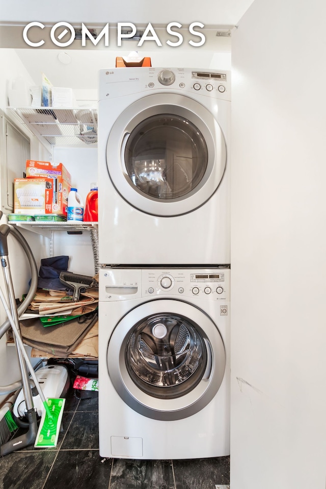 laundry area featuring laundry area and stacked washing maching and dryer