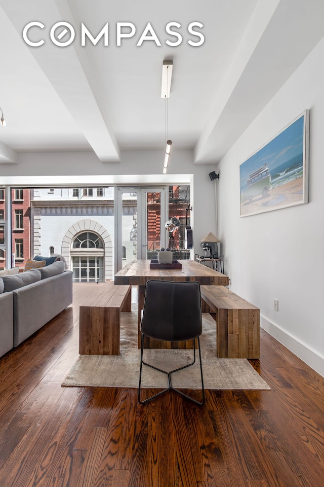 bar featuring baseboards and wood finished floors