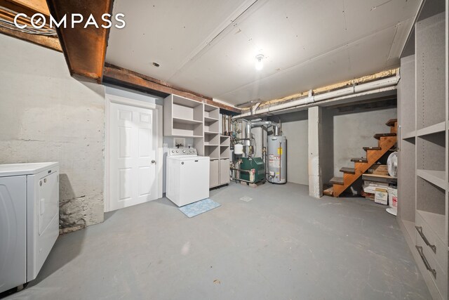 unfinished basement with stairway, gas water heater, and independent washer and dryer