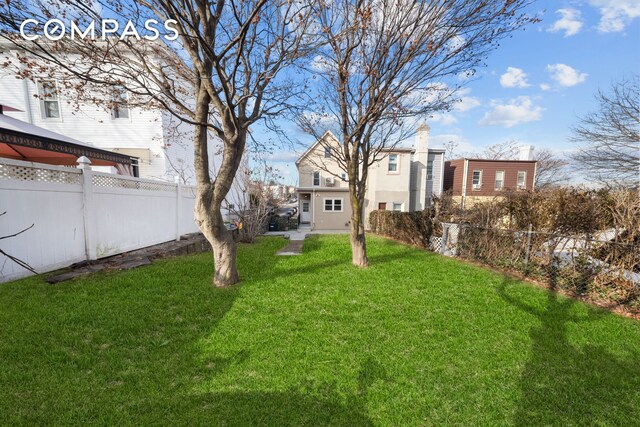 view of yard featuring a fenced backyard