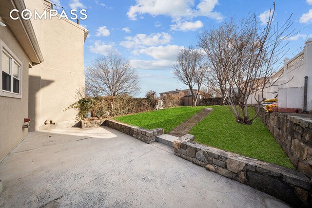 view of yard with a patio area and fence