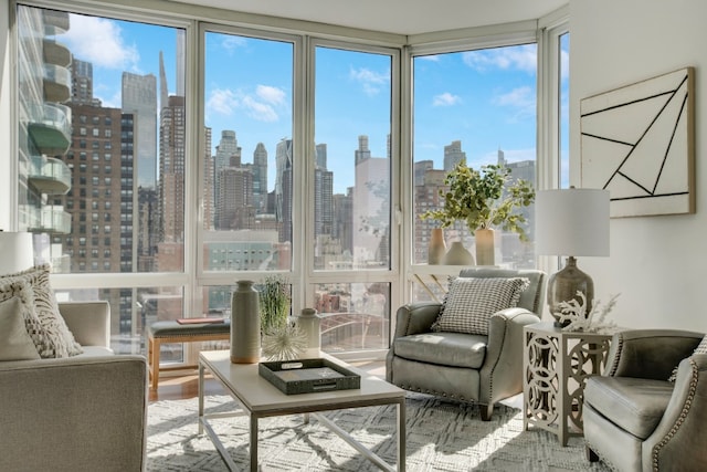 sunroom / solarium featuring a city view