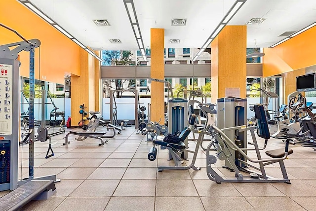 workout area with expansive windows and visible vents