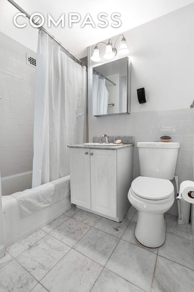 305 E 72nd St Unit 13I, New York City, NY 10021 - full bathroom featuring vanity, toilet, and shower / tub combo with curtain