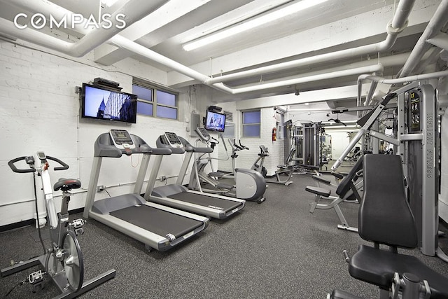 305 E 72nd St Unit 13I, New York City, NY 10021 - gym featuring brick wall