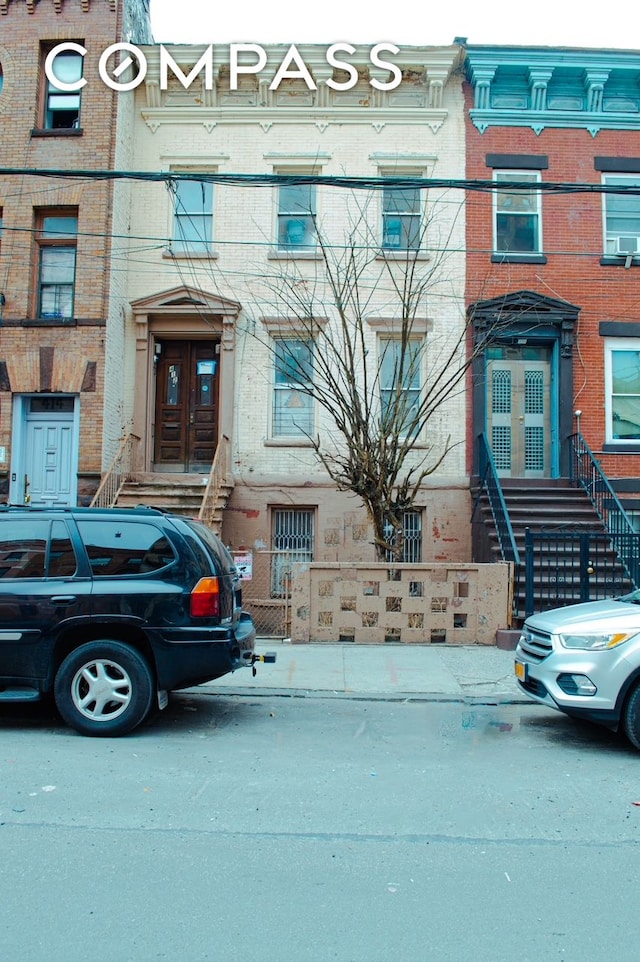 412 E 136th St, New York City, NY 10454 - townhome / multi-family property with brick siding