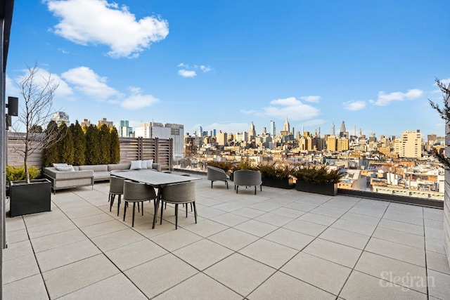 view of patio featuring outdoor lounge area and a city view