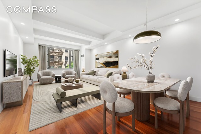 living room featuring recessed lighting, baseboards, and wood finished floors