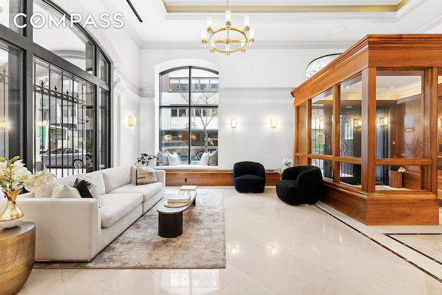 43 W 64th St Unit 4D, New York City, NY 10023 - tiled living area with ornamental molding, a chandelier, a high ceiling, and a tray ceiling