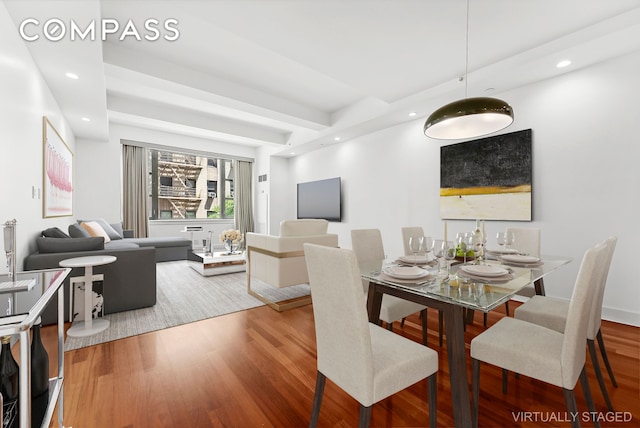 dining space featuring recessed lighting and wood finished floors