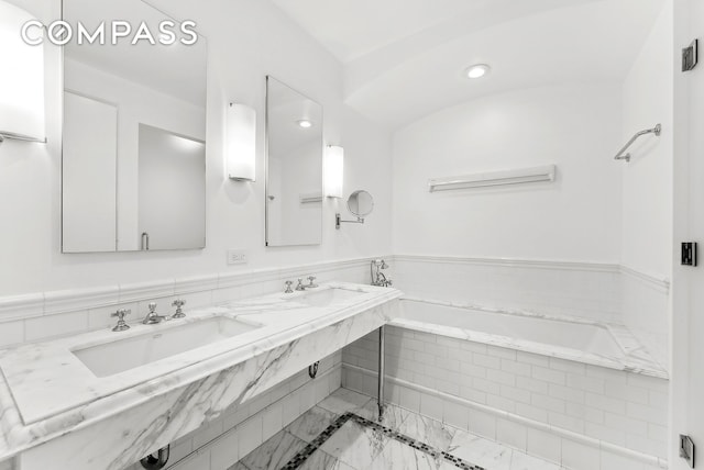 43 W 64th St Unit 4D, New York City, NY 10023 - bathroom featuring a garden tub and double vanity