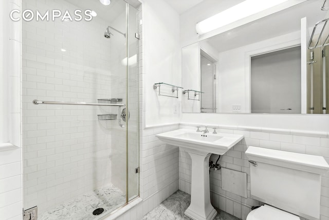 43 W 64th St Unit 4D, New York City, NY 10023 - bathroom with a stall shower and a wainscoted wall