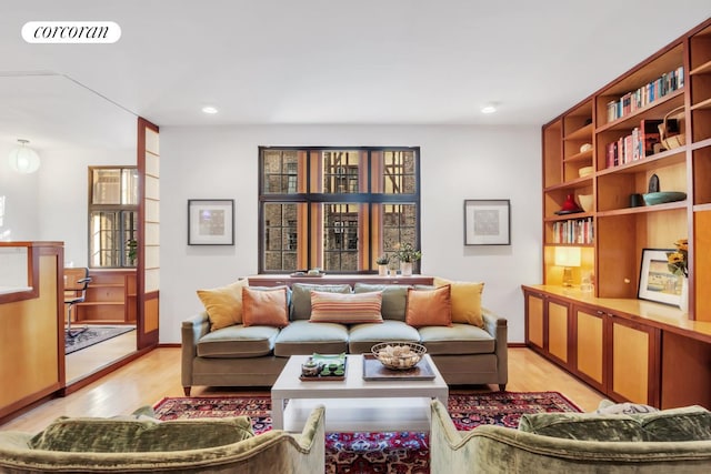 116 Pinehurst Ave Unit G33, New York City, NY 10033 - living room featuring light wood-style flooring, recessed lighting, and baseboards