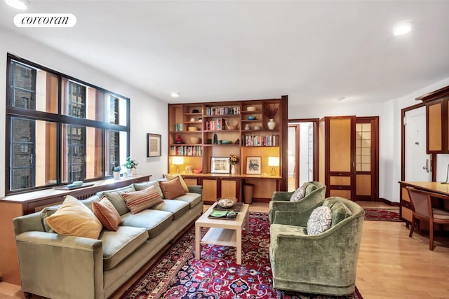 sitting room with light wood finished floors, visible vents, and recessed lighting