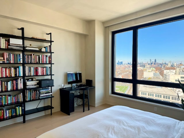 bedroom with light wood finished floors