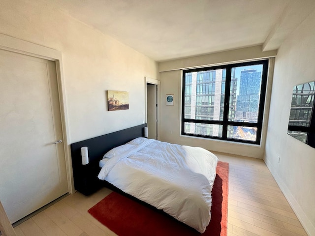 bedroom featuring light wood-style flooring