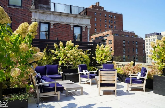 view of patio featuring outdoor lounge area and a balcony