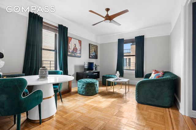 sitting room with ceiling fan