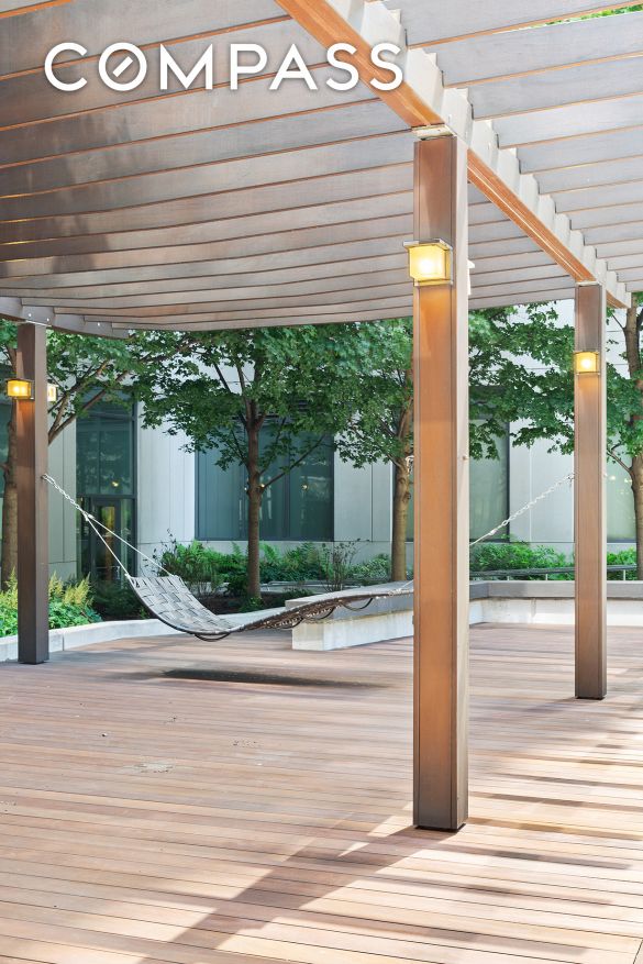 wooden terrace with a pergola