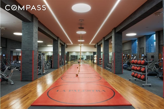exercise room featuring ornate columns