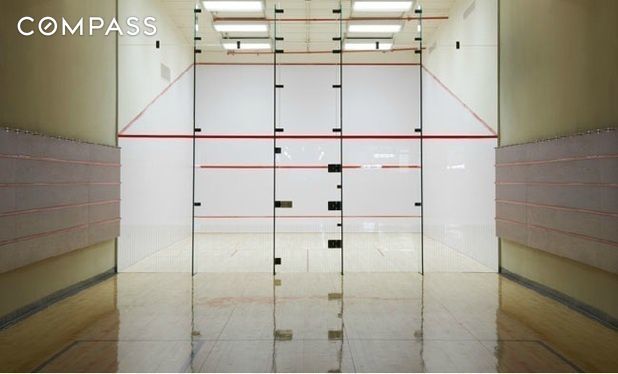 unfurnished room featuring a sport court