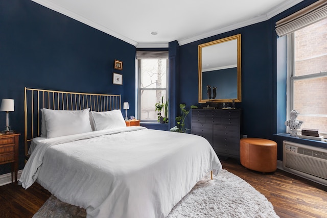 bedroom with dark wood-style floors and crown molding