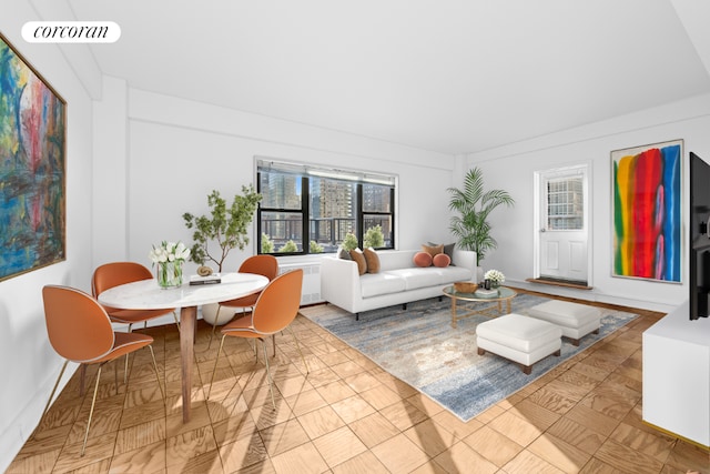 living area featuring visible vents and baseboards