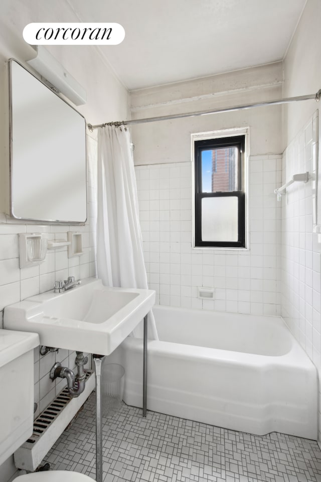 full bathroom with tile walls, backsplash, toilet, shower / tub combo, and tile patterned floors