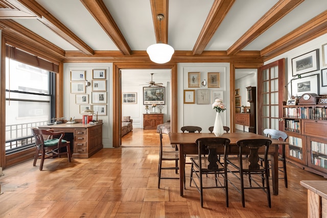 dining room with ceiling fan and beamed ceiling