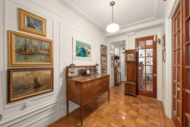 sitting room with ornamental molding and a ceiling fan