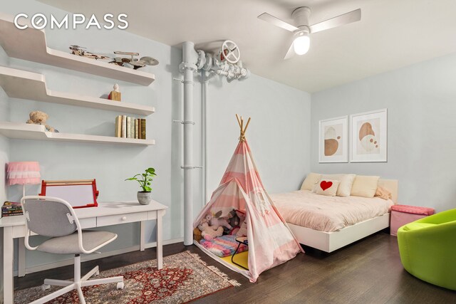 bedroom featuring a ceiling fan and wood finished floors