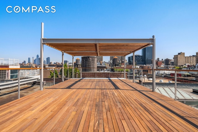 wooden terrace with a city view