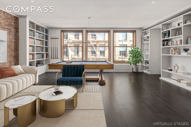 living area featuring brick wall, dark wood-type flooring, billiards, and built in features