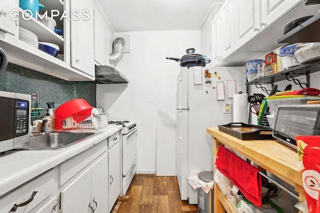 kitchen featuring light countertops, dark wood finished floors, white cabinetry, and under cabinet range hood