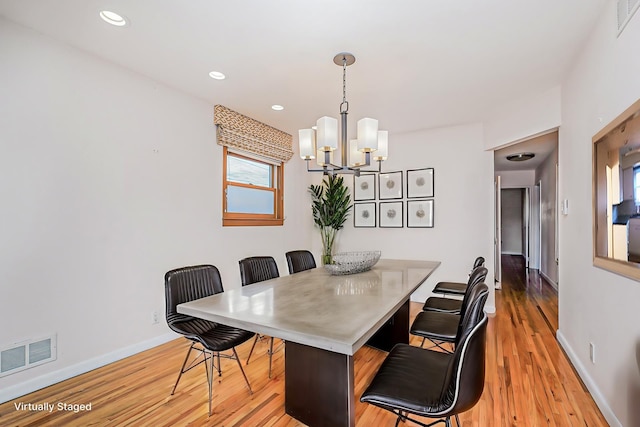 dining area with light wood-style floors, baseboards, visible vents, and recessed lighting