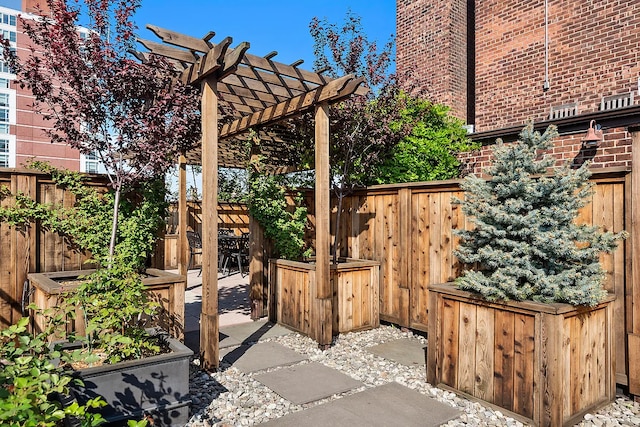 view of patio with fence and a pergola