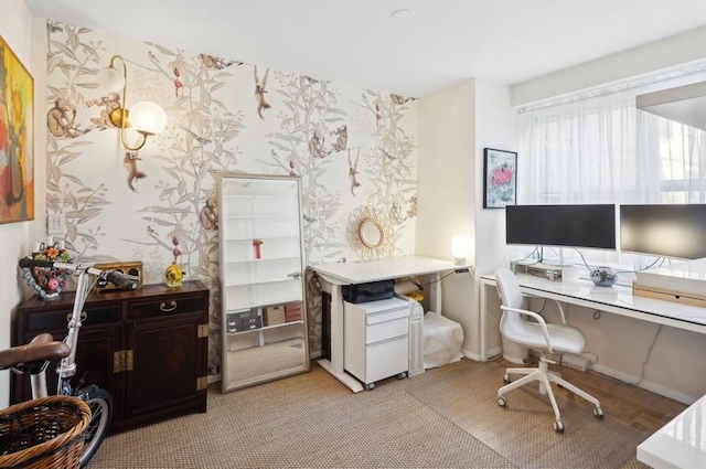 home office with wallpapered walls