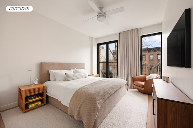 bedroom featuring a ceiling fan, visible vents, and baseboards